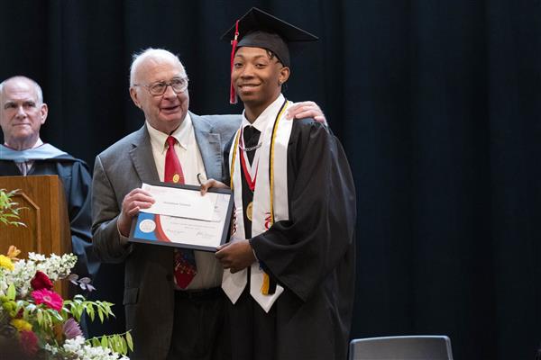 A 2023 graduate being awarded an AIDB Trustee Scholarship. 